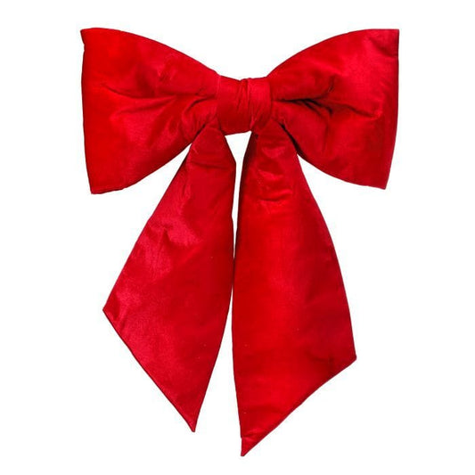 Large red velvet decorative bow with two loops and trailing tails, front view