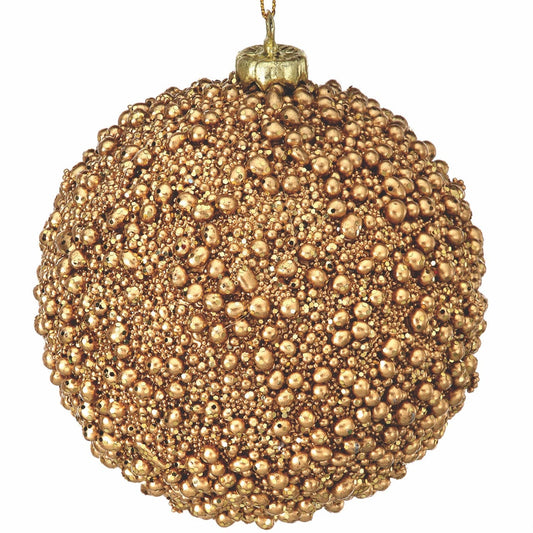 Round Christmas ball ornament covered in metallic gold mini beads and glitter, hanging view