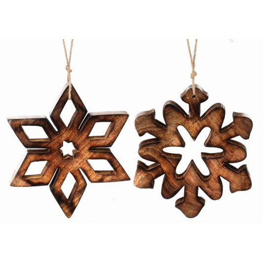 Two carved wooden snowflake ornaments with cutout designs hanging from jute twine, front view