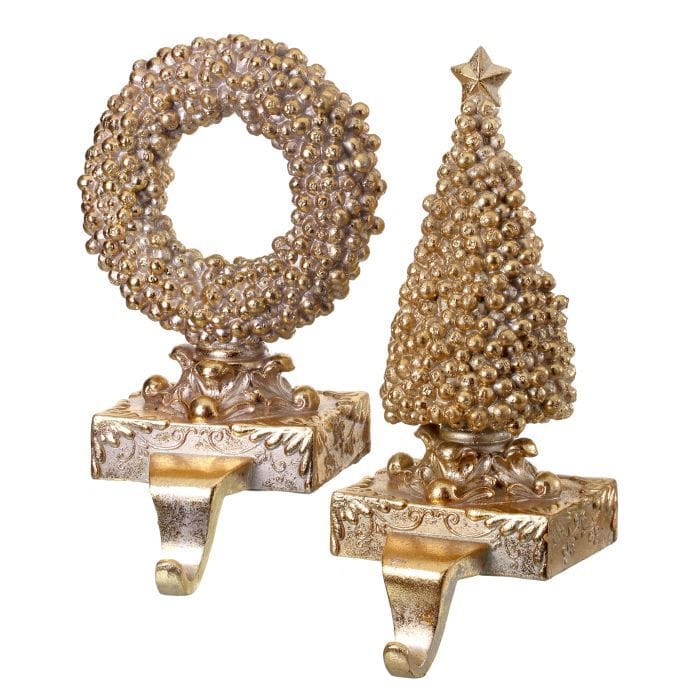 Two gold gilded berry stocking holders shaped as a wreath and Christmas tree with ornate bases