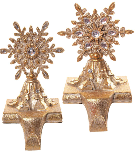 Pair of gold resin jeweled snowflake stocking holders with crystal embellishments, front view
