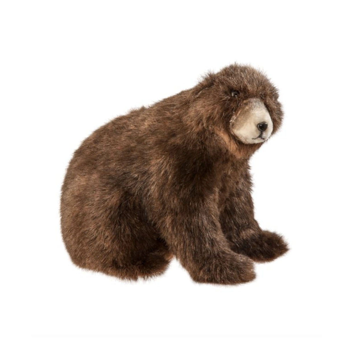 Realistic stuffed faux fur brown bear in seated position, side-angle view