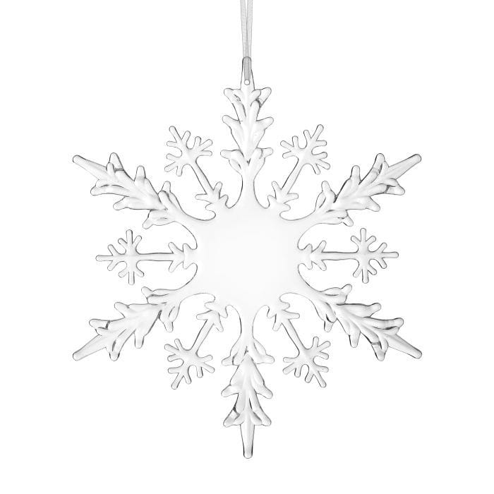 Clear acrylic snowflake ornament with intricate cutout design, hanging from white ribbon