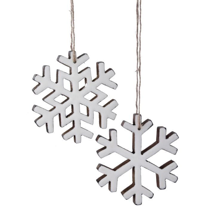 Two white enamel-coated wooden snowflake ornaments hanging from natural twine strings