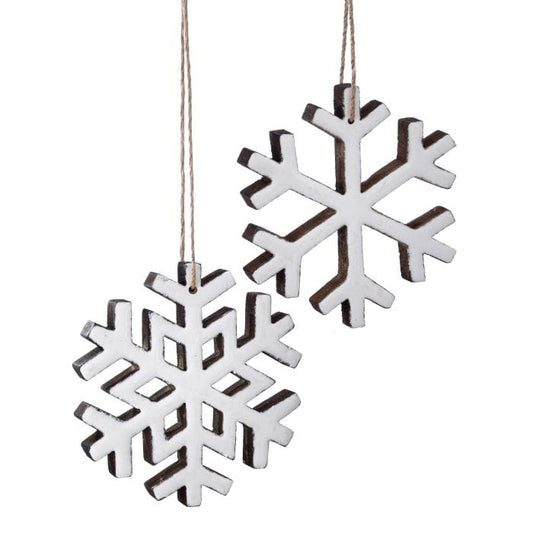Two wooden snowflake ornaments with white enamel finish and twine hangers, front view