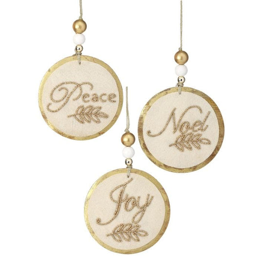 Set of three round cream and gold ornaments reading Peace, Noel, and Joy with beaded details