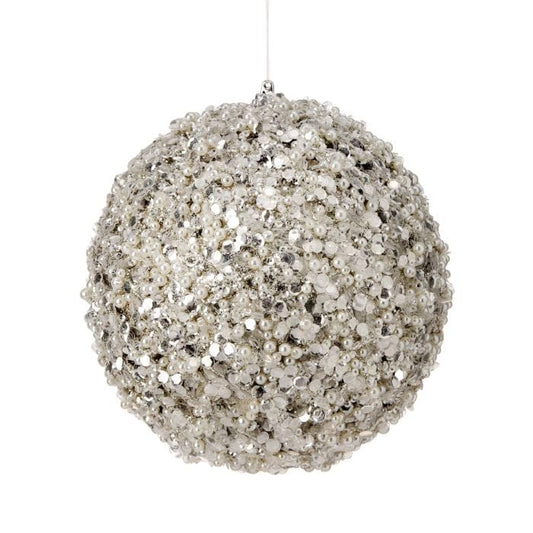 Round holiday ball ornament covered in silver glitter sequins and white pearl beads, hanging view