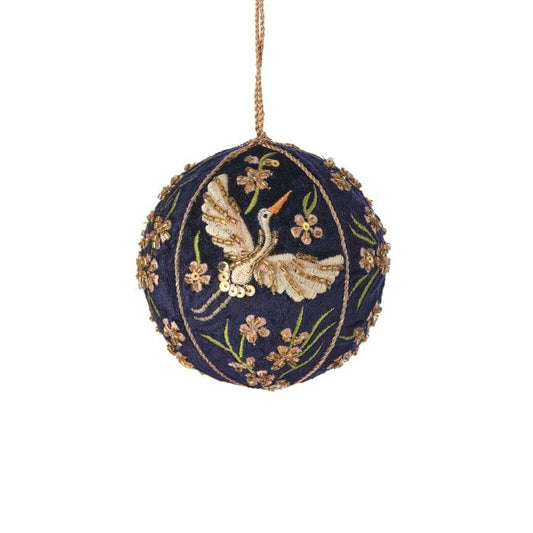 Navy velvet ball ornament with embroidered crane, floral beadwork, and gold accents, hanging view