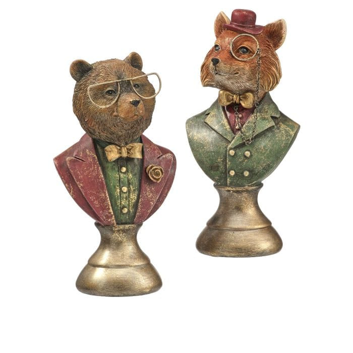 Two decorative resin animal busts, a bear and fox, wearing glasses and dapper suits on gold pedestal bases
