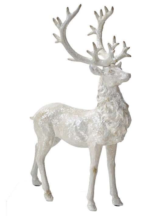 Large standing resin stag figurine with tall antlers, glittery snow-dusted white finish, side view