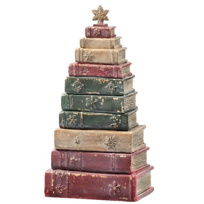 Stacked vintage-style resin books arranged as a Christmas tree with a snowflake star topper