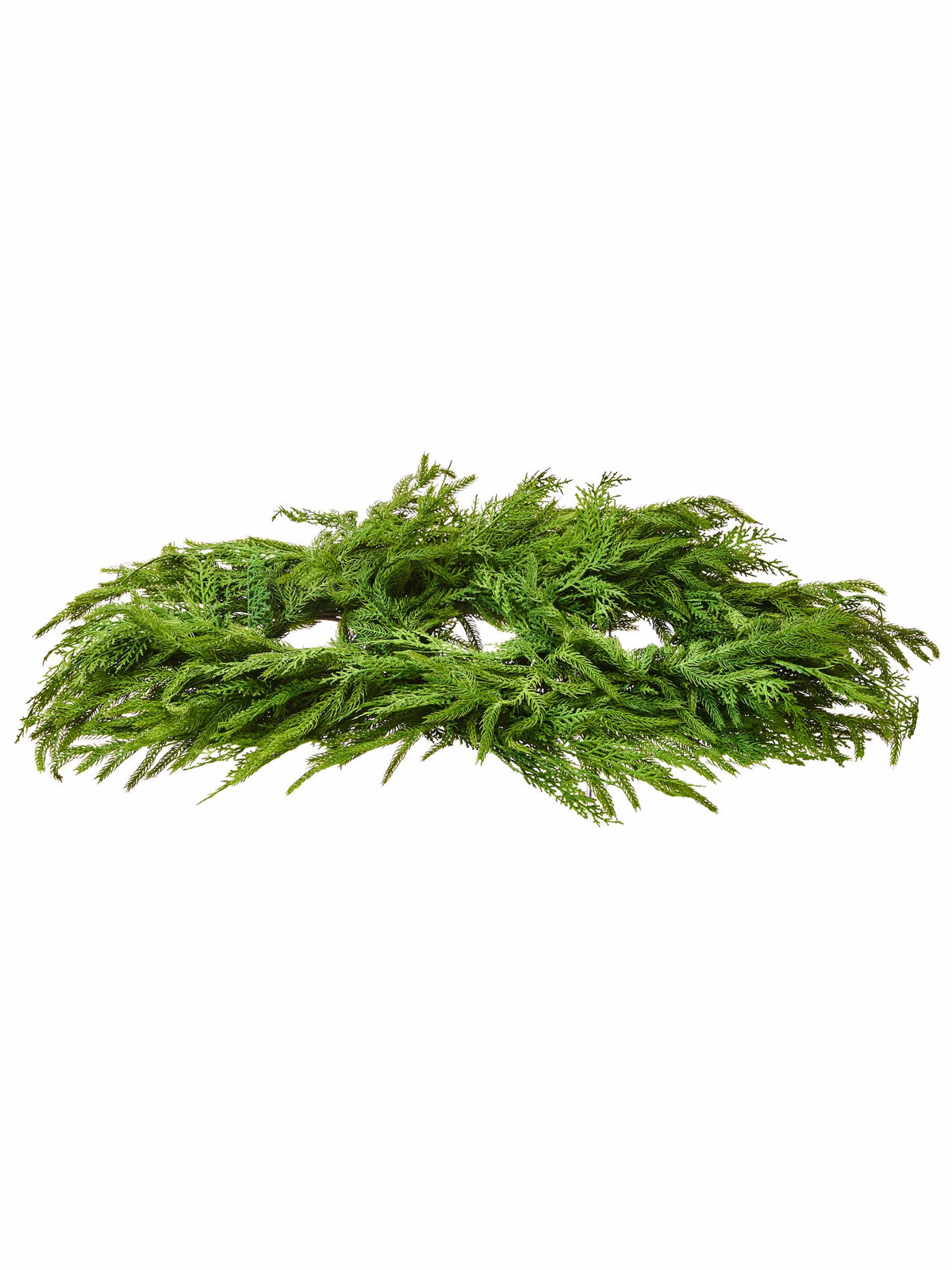 Oval evergreen centerpiece arrangement with lush cedar and pine foliage, top-angle view