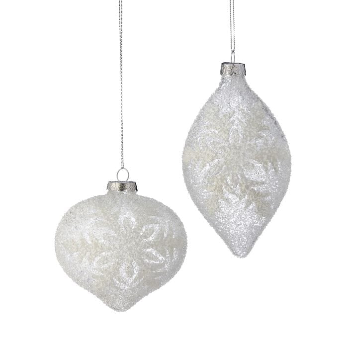 Two frosted glass ornaments with beaded snowflake designs: round ball and elongated finial shapes