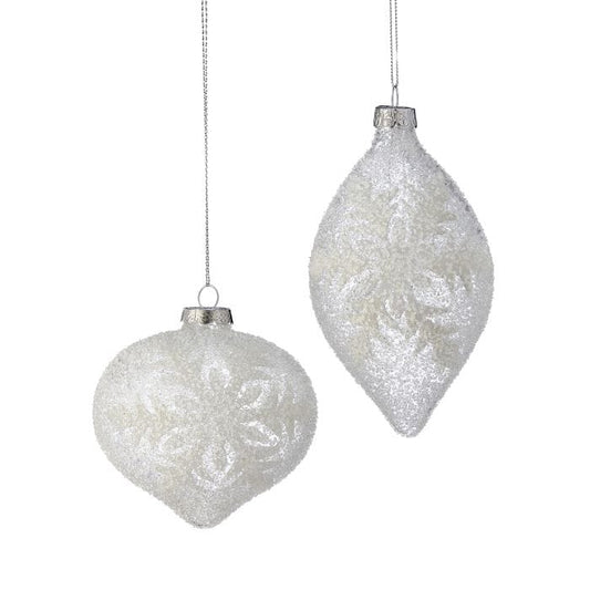 Two frosted glass ornaments with beaded snowflake designs: round ball and elongated finial shapes