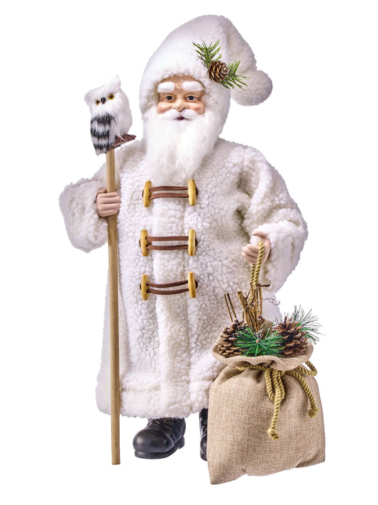 Santa Claus figurine in white sherpa coat holding a wooden staff with a white owl perched on top