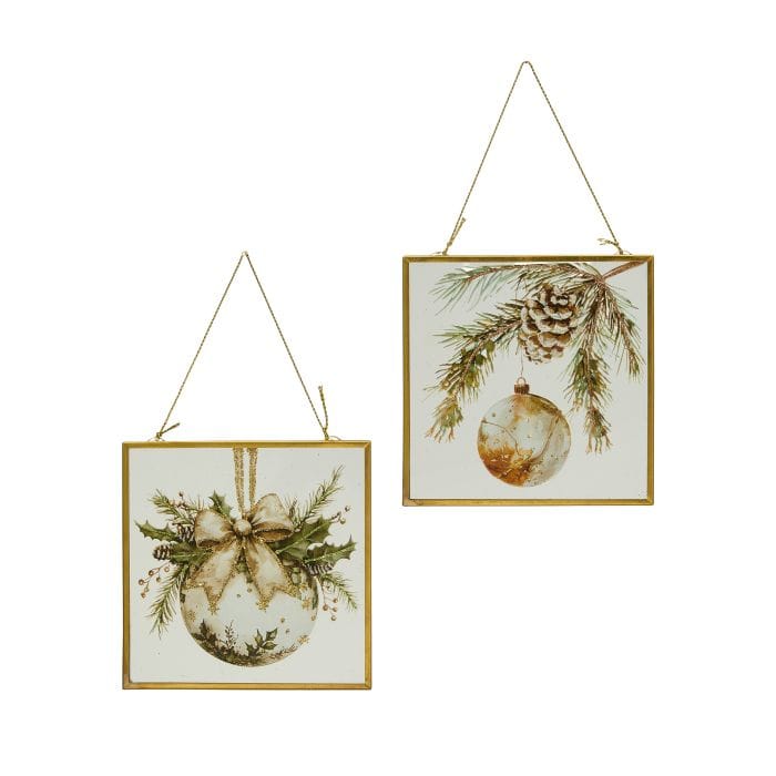 Two square gold-framed glass ornament art pieces with watercolor Christmas ball and pine cone designs