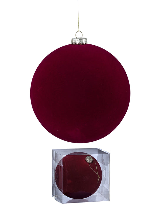 Large flocked velvet ball ornament in deep red with silver cap, shown hanging and in clear box packaging