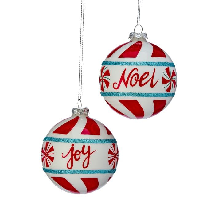 Two glass ball ornaments with peppermint candy design, reading 'Joy' and 'Noel' in red script