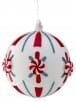 White glass ball ornament with red peppermint stripes and candy dot accents