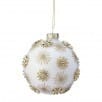 White frosted glass ball ornament with gold glitter starburst jewel accents hanging by gold cap