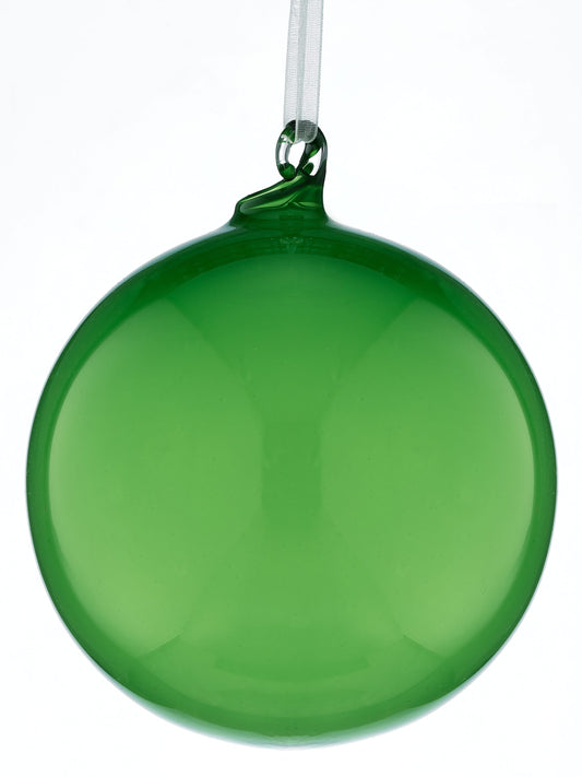 Shiny green glass ball ornament hanging from a white ribbon, front view