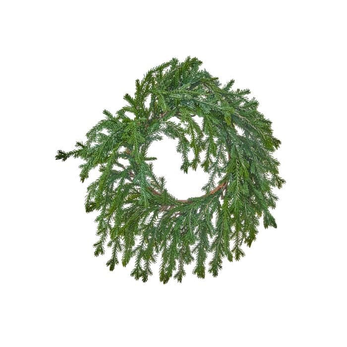 Circular evergreen candle ring with weeping fir branches and open center, top view
