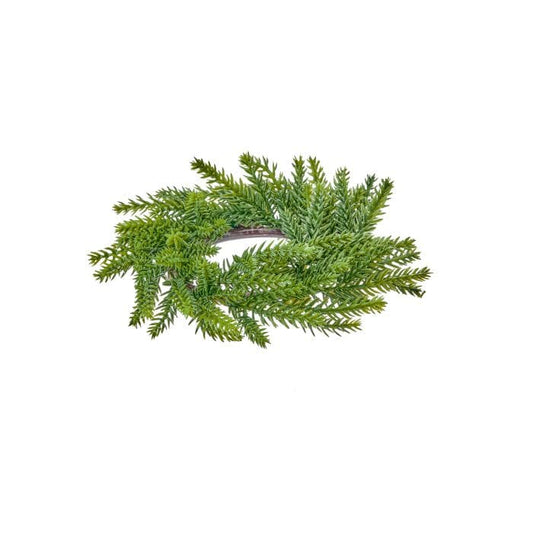Small circular evergreen candle ring with fir branches radiating outward, top view