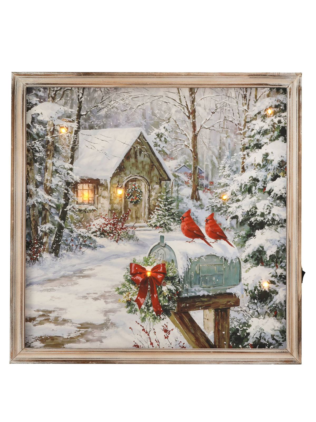 Framed LED winter scene canvas art with two red cardinals perched on a snow-covered mailbox near a cozy cottage