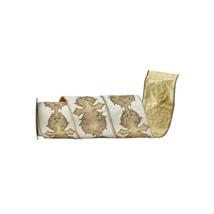 Roll of wide ivory velvet ribbon with gold embroidered cross and scroll motifs, unrolled end visible