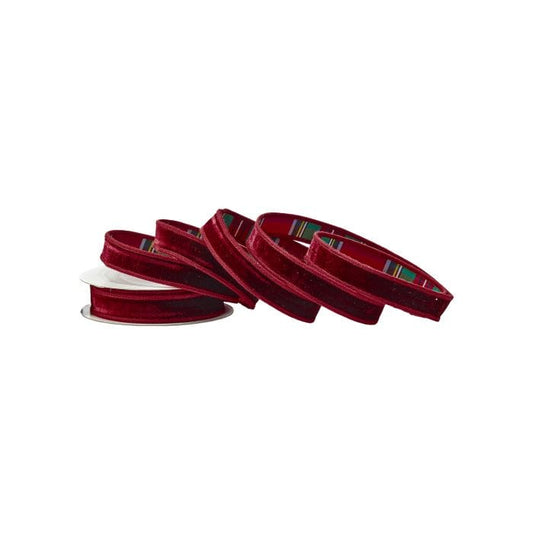 Burgundy velvet ribbon spools showing plaid backing, one small spool and three larger rolls