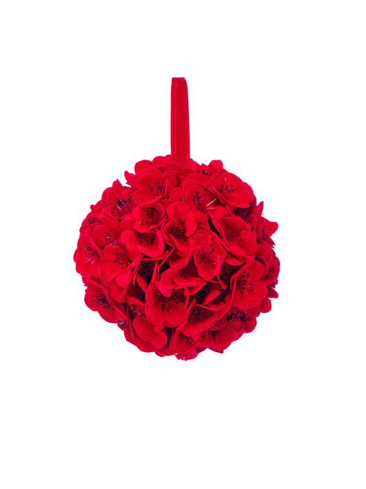 Spherical kissing ball densely covered in red velvet cherry blossoms with a ribbon loop hanger