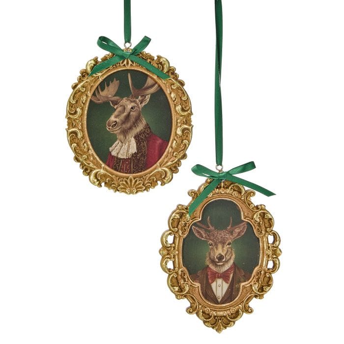 Two oval gold baroque-framed ornaments featuring dressed deer bust portraits, hung with green ribbon bows