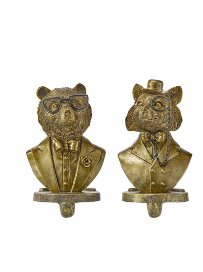 Two gold resin animal bust stocking holders featuring a bear and fox in gentlemen attire