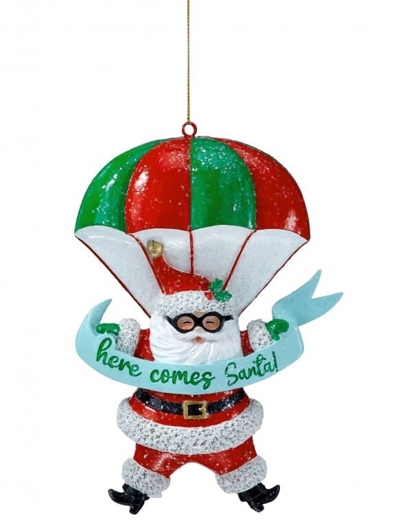 Glittered resin Santa Claus skydiving ornament with red green parachute here comes Santa banner