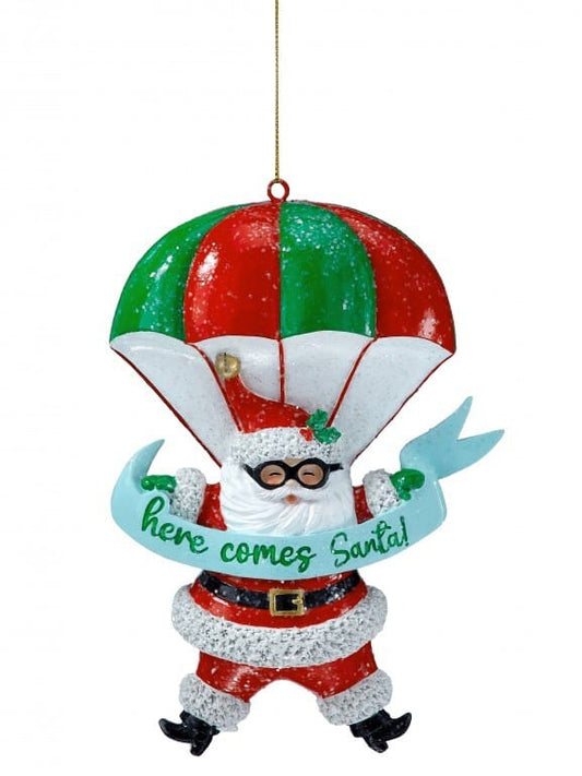 Glittered resin Santa Claus skydiving ornament with red green parachute here comes Santa banner