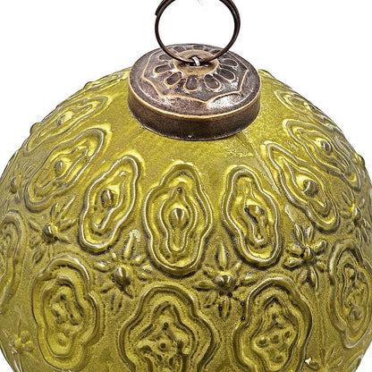 Round embossed glass ornament in olive green with intricate raised paisley patterns and antique brass cap