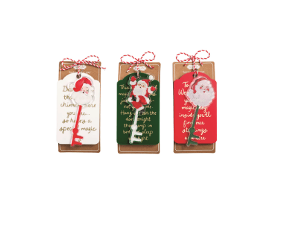 Three Mudpie Santa magic keys in white, green, and red with matching sentiment gift tags