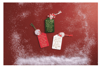 Three red and green Santa sentiment gift tags with decorative keys on red background