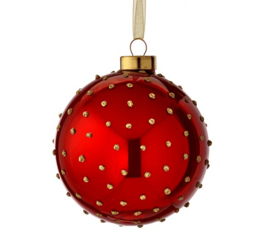 Shiny red glass ball ornament with raised gold dimpled dots and gold cap