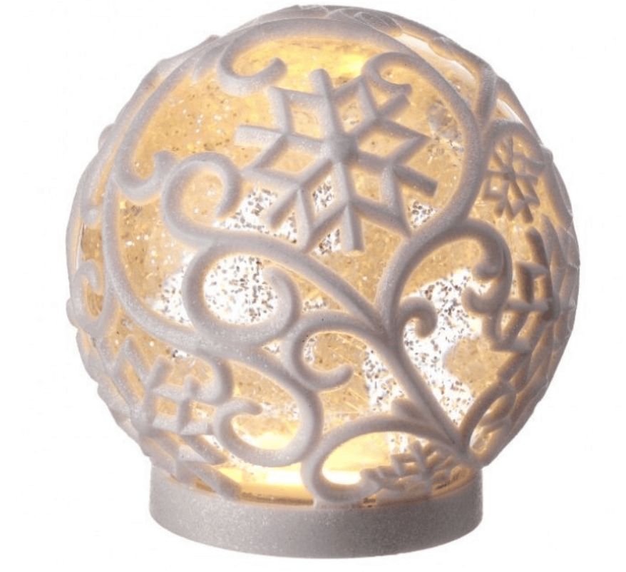 Illuminated white frosted glass snowflake ball globe with swirl design and warm LED glow