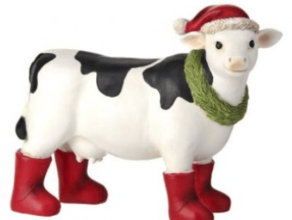 Resin cow figurine wearing red boots, Santa hat, and green wreath scarf