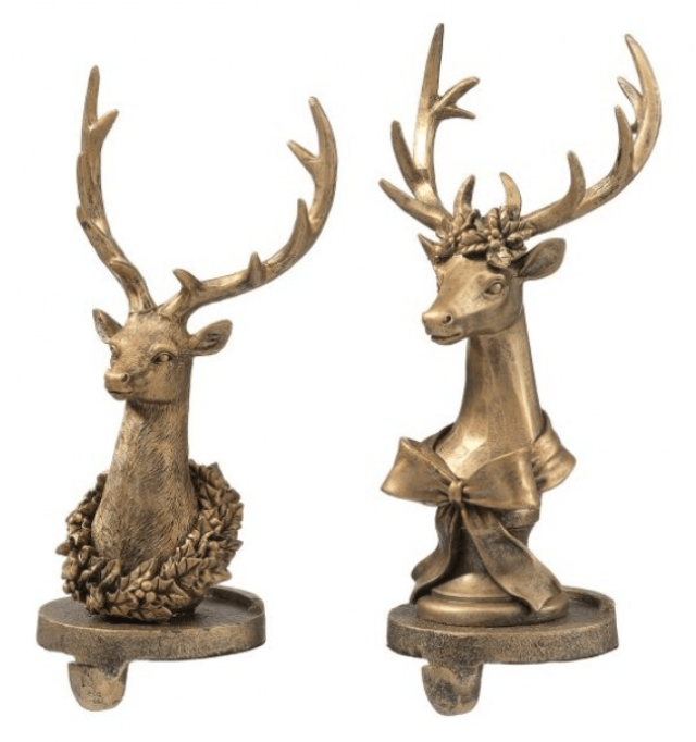 Two gold resin deer head stocking holders with antlers, wreath and bow accents