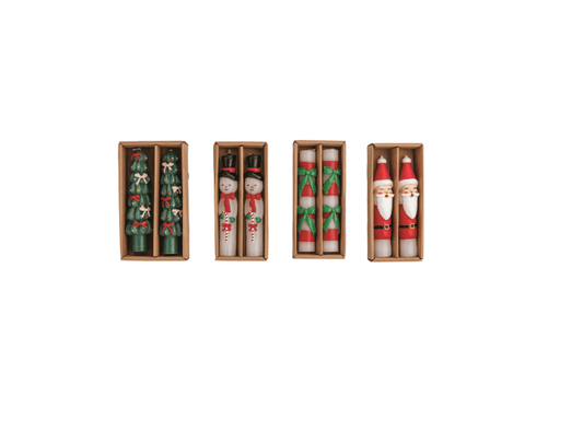 Four boxed Christmas mini taper candle sets featuring tree, snowman, candy cane, and Santa designs