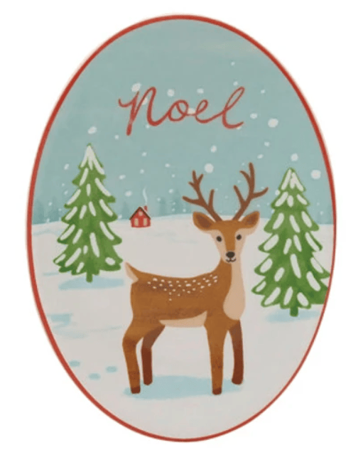 Oval stoneware dish with reindeer, snow-covered trees, and Noel text