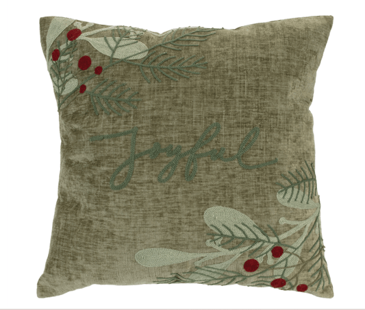 Sage green velvet throw pillow with embroidered Joyful script, holly berries, and pine branches