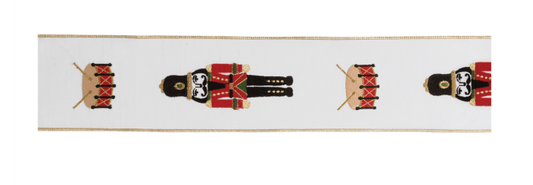 White wired ribbon with repeating red and black nutcracker soldier and drum pattern