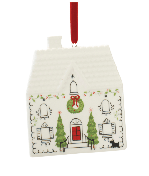 White dolomite house-shaped Christmas ornament with wreath, trees, and red ribbon hanger
