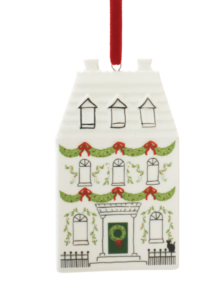 White dolomite house ornament with Christmas garlands, wreath, and red ribbon hanger