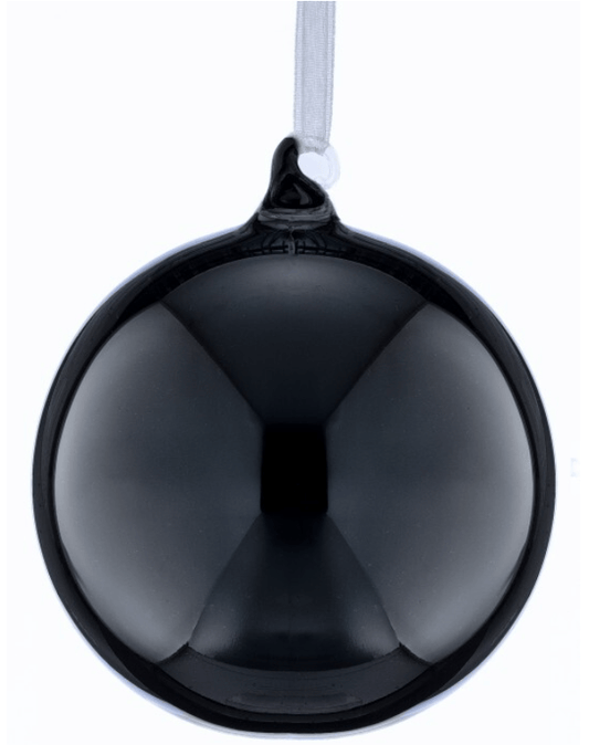 Shiny black glass ball Christmas ornament hanging from white ribbon
