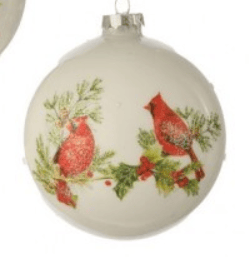 White glass ball ornament with red cardinals, holly, and pine branches